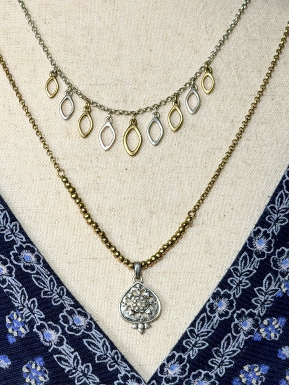 Lucky Brand Two-Tone Gold and Silver Charm Necklace, adjustable 16-21 inches.